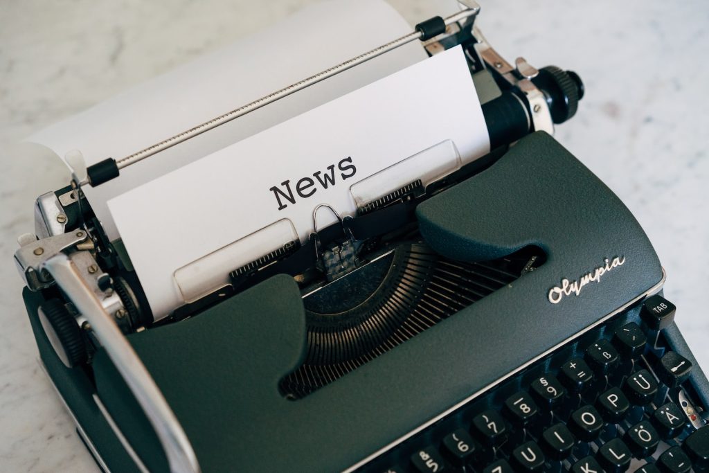 typewriter with news title